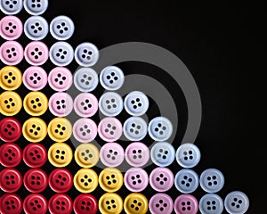 Large Group Of Colorful Plastic Sewing Buttons On Black Background