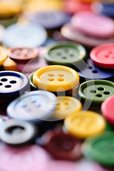 Large Group Of Colorful Plastic Sewing Buttons On Table