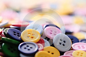 Large Group Of Colorful Plastic Sewing Buttons On Table