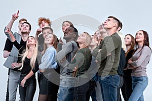 Large group of friends looking up hopefully . isolated on white