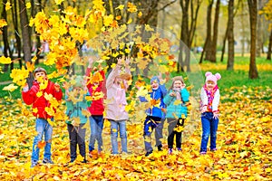 Large group of friends play in a beautiful autumn park