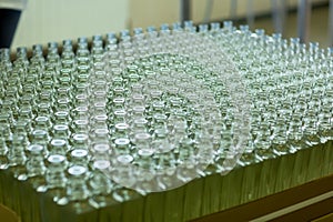 Large group of green recycled glass wine bottles at winery