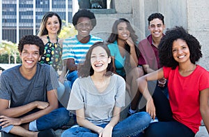 Large group of happy multiethnic young men and women