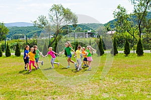 Large group of kids play outdoor games