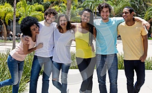 Large group of laughing international young adult people