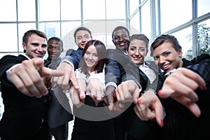 Large group of multiethnic business people pointing their finger