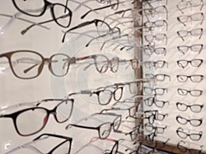 Large group of optical eyeglasses and eyewear.on disply on a wall