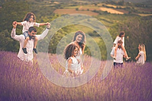 Large group of people in lavender field.