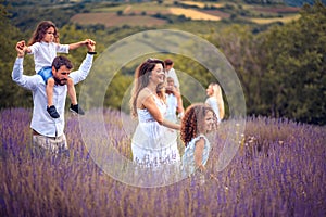 Large group of people in lavender field.