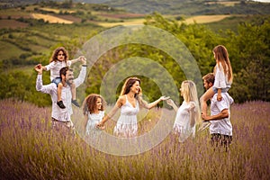 Large group of people in lavender field.  Day in nature with friends
