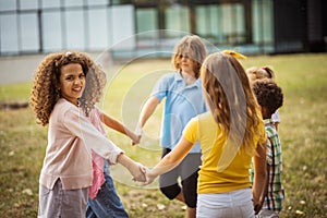 Large group of school kids having fun in nature.  Let the fun begin