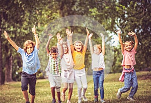 Large group of school kids having fun in nature Wonderful childhood