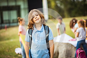 Large group of school kids in nature.