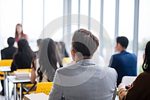 Large group in seminar class room to agree with speaker at conference seminar meeting room.