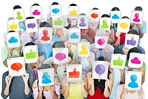 Large Group of World People Holding Digital Tablets with Social Media Icons