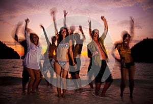 Large group of young people enjoying a beach party