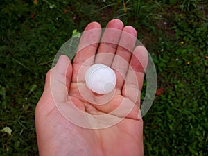 A large hailstone in your hand after a summer hurricane