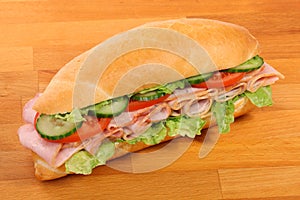 A large ham and tomato sandwich