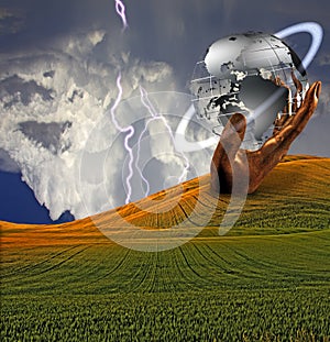 Large hand and earth sculpture