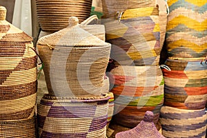 Large hand-made colored baskets in an African market