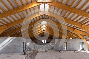 Large hangar. Glued laminated timber construction. Roof construction of laminated veneer lumber. Building. Glued laminated timber