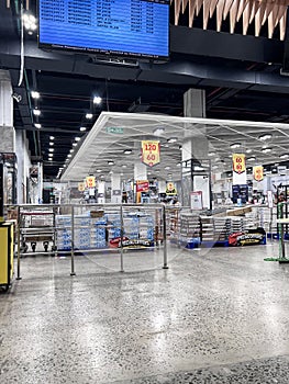 a large hardware store, tools and material. interior of home improvement retailer, racks of door hardware, weather proofing and