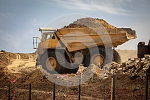 large haul dump truck at a construction site filled with dirt