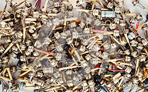 Large heap of old transistors on white background