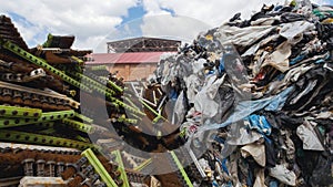 Large heaps of plastic canisters and boxes, ecology concept