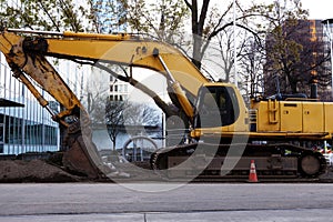 Large Heavy Construction Equipment Idle Downtown Site