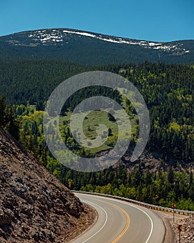 Large highway curve with mountain landscape in background