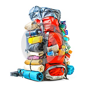 Large hikers backpack crammed with things isolated on white background.