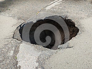 Large hole in the asphalt, sinkhole