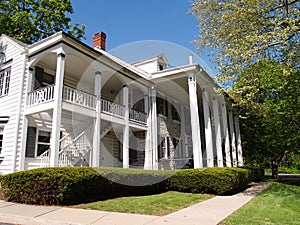 Large home with front porch with columns