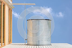 Large home water tank for collecting and storing rainwater photo