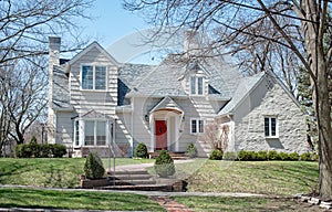 Large House with White Shake Siding and Bay Window