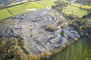 Large housing development aerial view in construction on rural countryside site Scotland UK