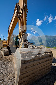 Large hydraulic backhoe in mountains