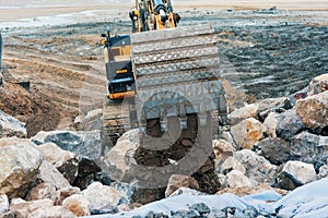 large hydraulic excavator in action on a construction site close-up