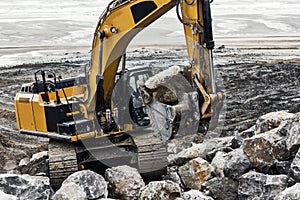 large hydraulic excavator in action on a construction site close-up