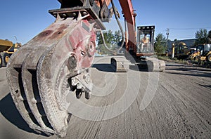Large hydraulic Jaw Crusher on Excavator photo