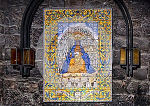 Large image of the Black Madonna on painted tiles along the Ave Maria Path in the Basilica at Santa Maria de Montserrat Monastery.