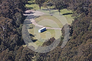 A large implement shed in a valley in the Central Tablelands in regional Australia