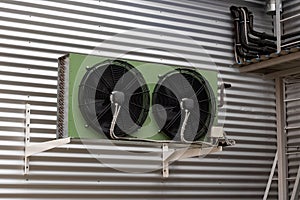 Large industrial air conditioning on a building wall