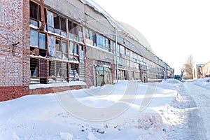 Large industrial building abandoned of factory with broken windows