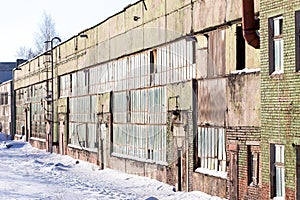 Large industrial building abandoned of factory with broken windows