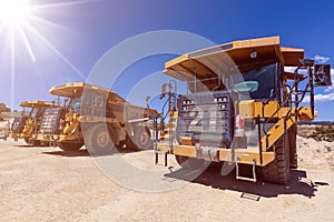 Large industrial dumper trucks.