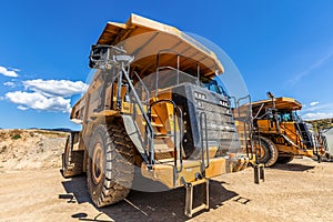 Large industrial dumper trucks.