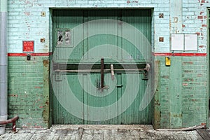 Large industrial elevator propped open in an abandoned factory