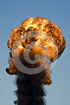 Large industrial fire with thick black smoke